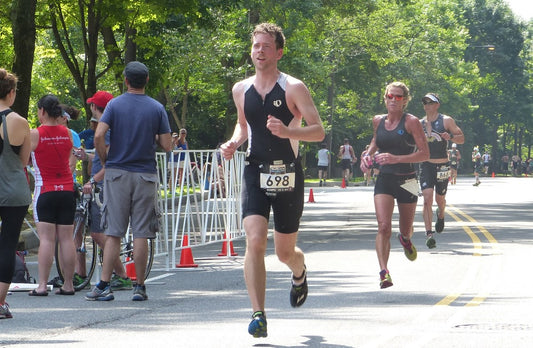 man running with a race belt