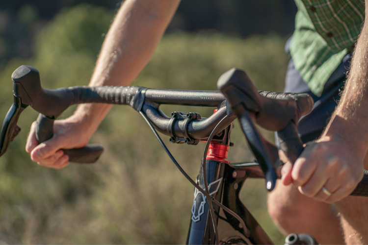 image of man riding bike with riser drop bars 